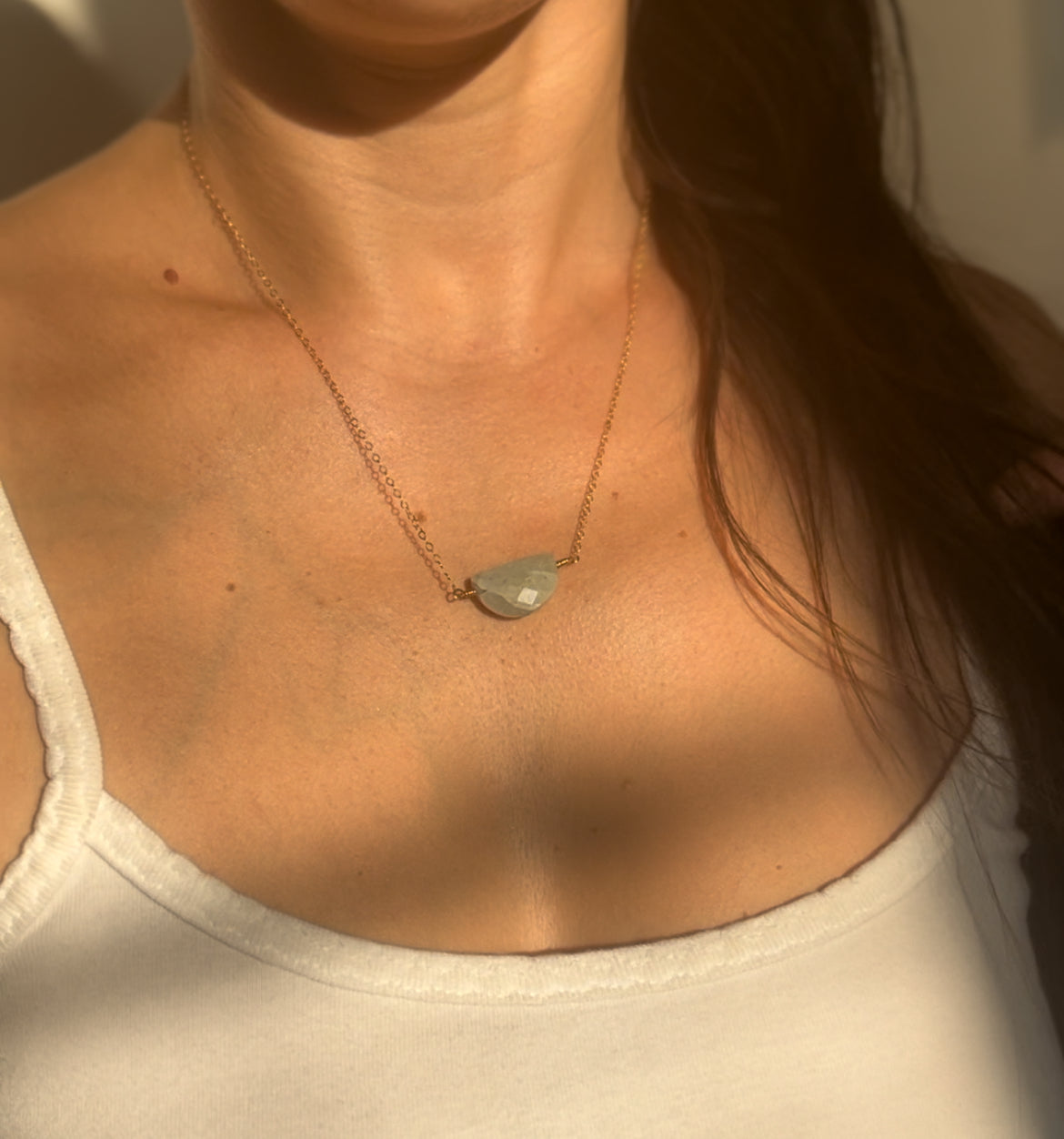 woman wearing the aquamarine necklace