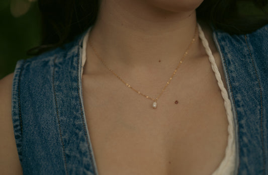 woman wearing a 14k gold filled cable chain necklace with a single, small fresh water pearl